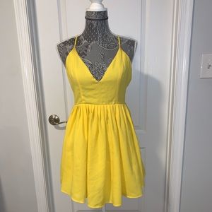 Bright yellow mini and backless dress